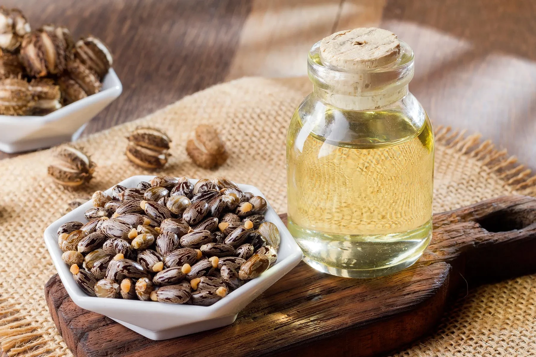 Castor oil bottle with castor seeds